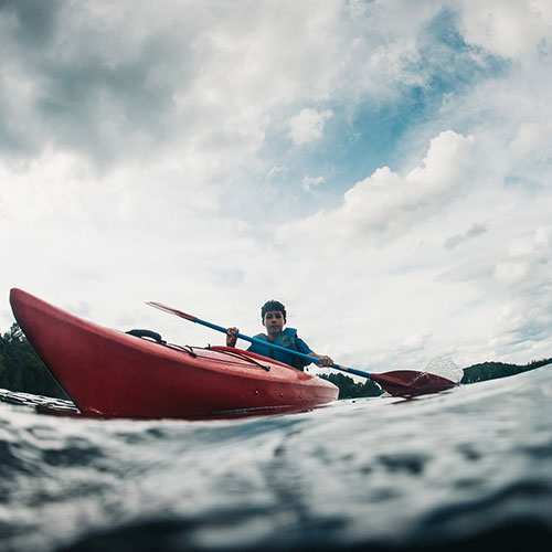 Image of a Camp Huronda camper kayaking